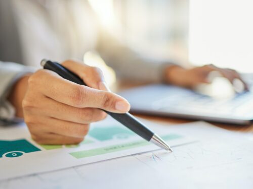 Economy worker, finance and accounting, a manager writing and working out his business budget strat